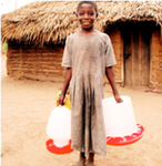 A Rufiji farmer's daughter carries a chicken feeder and drinking system