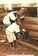Director empowering an orphan in his home with an income generating project of piggery Director empowering an orphan in his home with an income generating project of piggery